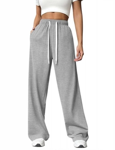 Detail of light gray wide-leg joggers with high elastic waist and white drawstring