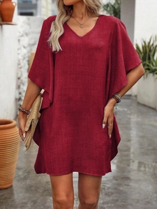 Detailed texture of wine red V-neck dress with loose butterfly sleeves and linen fabric