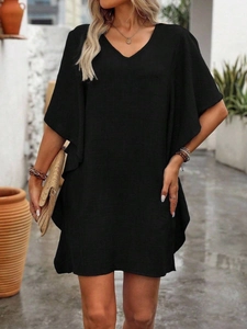 Detail of V-neckline and ruffle butterfly sleeves on a loose black summer dress
