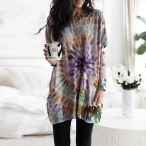 Detailed close-up of a loose tie-dye sweatshirt dress with side pockets and batwing sleeves