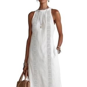 White sleeveless halter maxi dress featuring geometric lace embroidery and side pockets