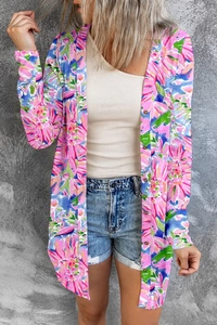 Detail of colorful floral tropical print long sleeve cardigan with wooden buttons and vibrant colors