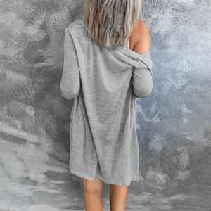 Detail view of the back of a light grey long-sleeved cardigan with heathered knit texture
