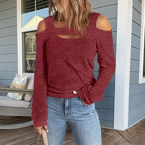 Detail of burgundy cold shoulder top showing cutout neckline and soft knit texture