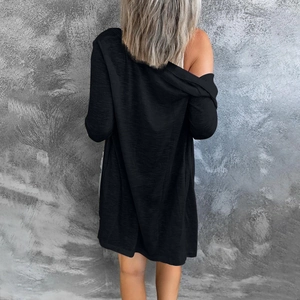 Rear view of women's long black buttonless cardigan with soft breathable fabric