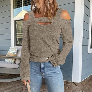 Detail of cold-shoulder knit top featuring front cutout and breathable texture