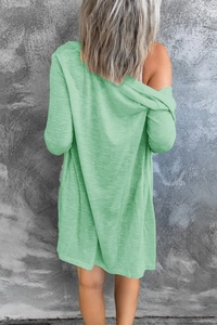 Rear view of long-sleeve mint green cardigan with horizontal slub texture fabric