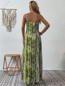 Detail of a floral maxi dress showing the open back and adjustable spaghetti straps