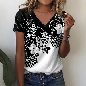 Detail of V-neck floral t-shirt featuring black and white gradient flower patterns