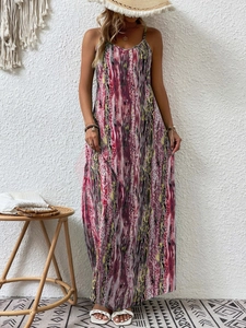 Detail of summer floral maxi dress with thin straps and abstract colorful print texture