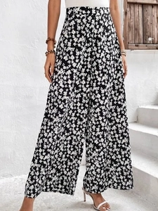 Pantalon fleuri taille haute à coupe large et fluide idéal pour les vacances d'été