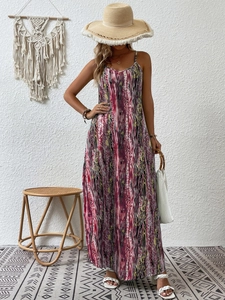 Detail of bohemian floral maxi dress with thin straps and abstract colorful pattern