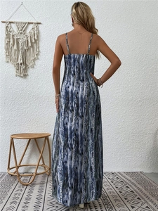 Detail of blue abstract print maxi dress showing back silhouette and strap design