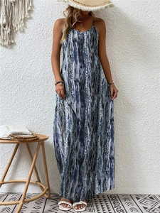 Detail of bohemian spaghetti strap maxi dress with blue and white abstract print