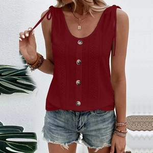 Detail view of burgundy eyelet embroidery top with tie straps and amber button accents