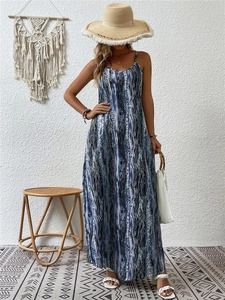 Detail of bohemian blue and white wavy print maxi dress with thin shoulder straps