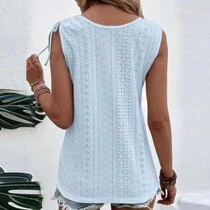 Back view of light blue sleeveless top with eyelet embroidery and shoulder bow tie detail