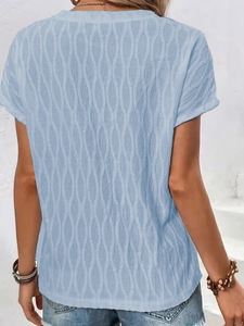 Detail shot of light blue t-shirt featuring unique textured 3D wave fabric pattern