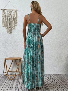 Detail of the back profile of a bohemian floral maxi dress with slim straps
