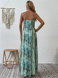 Back view of bohemian floral maxi dress with spaghetti straps in indoor setting
