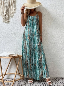 Detailed view of the sleeveless maxi dress with vibrant abstract vertical wave patterns
