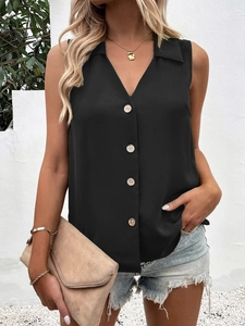 Detail of a black V-neck sleeveless chiffon top with light wooden buttons on front
