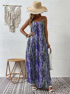 Detail of colorful abstract print maxi dress with spaghetti straps in resort style