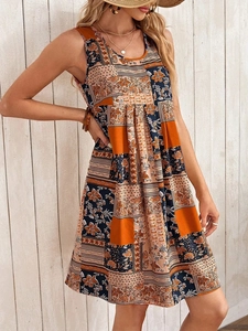 Detail of bohemian floral patchwork sleeveless A-line dress with warm orange and navy patterns