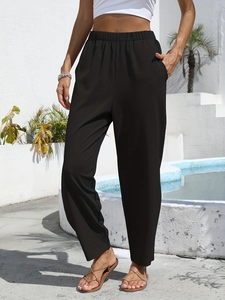 Women's black high-waisted cotton linen trousers with elastic waist and side pockets