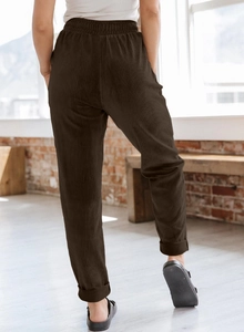 Detail of high-waist elastic waistband on dark brown corduroy wide-leg casual pants