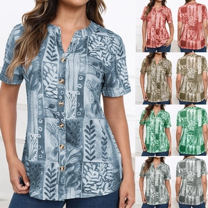 Close-up of women's short sleeve floral shirt with wooden buttons and V-neck detail