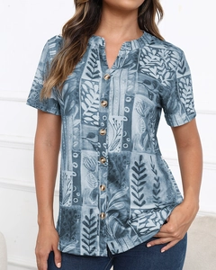 Detail of short sleeve V-neck floral print shirt featuring stylish buttons and casual fit
