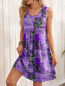Detail of bohemian purple patchwork floral print on sleeveless summer dress fabric