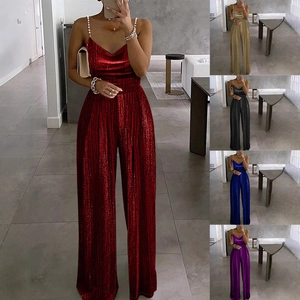 Detail of beaded spaghetti straps and glossy pleated fabric on V-neck jumpsuit