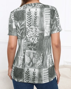 Detail of artistic floral and leaf print on the back of this casual short sleeve tee