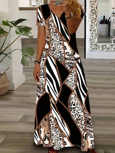 Detail of bohemian patchwork dress with leopard, zebra, and paisley print patterns