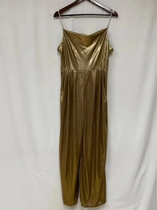 Detailed view of gold metallic pleated jumpsuit with elegant faux pearl beaded straps