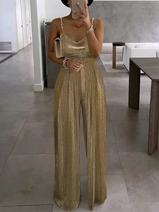 Elegant gold wide-leg jumpsuit with pleated metallic fabric and pearl strap details