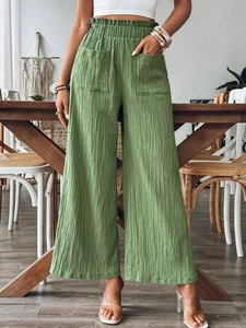 Sage green high-waisted wide-leg trousers with vertical pleated texture and side pockets