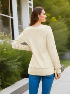 Detail of cable knit pattern and back fit on a solid long sleeve square neck sweater