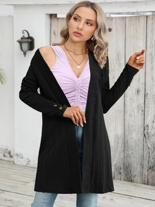 Detail of a black textured long-sleeve cardigan with buttons and pleated fabric for women