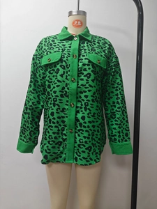 Detailed view of emerald green leopard print corduroy jacket with tortoise buttons