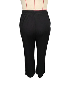 Rear view of black ribbed high-waisted lounge pants with elastic waist detailing