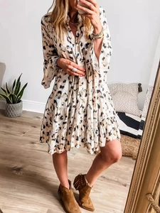 Women's floral print button-down maxi dress with long sleeves and ruffled hem design