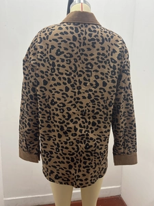 Detail of leopard print corduroy jacket featuring classic lapel and ribbed texture fabric