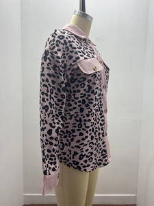 Detail of pink leopard print corduroy jacket with button pockets and textured collar