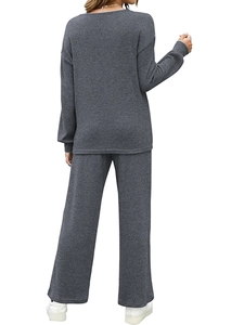Women's dark gray waffle knit lounge set featuring long-sleeve top and trousers back view