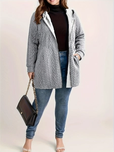 Detail of grey cable knit hooded cardigan showing honeycomb texture and side pockets