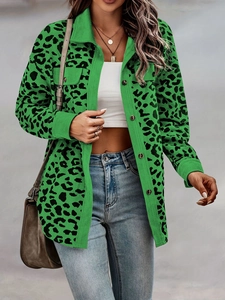 Detail of green leopard print corduroy jacket showing texture and flap pockets
