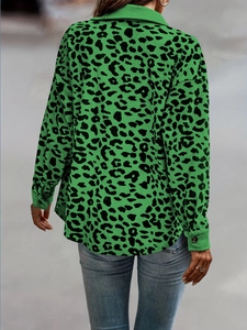 Detail of green leopard print corduroy jacket with ribbed texture and turn-down collar